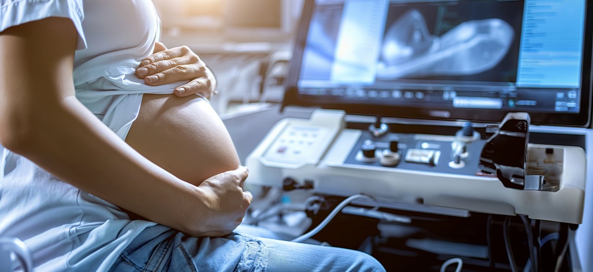 A pregnant woman undergoing an ultrasound scan as part of Assisted Reproductive Technology (ART) evaluation at BirthRight by Rainbow Hospitals.